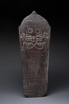 #INDO215: Dayak work board with intricate and bold figurative carving.