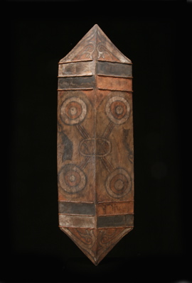 INDO217: Rare Dayak war shield with natural red, white and black pigment.
