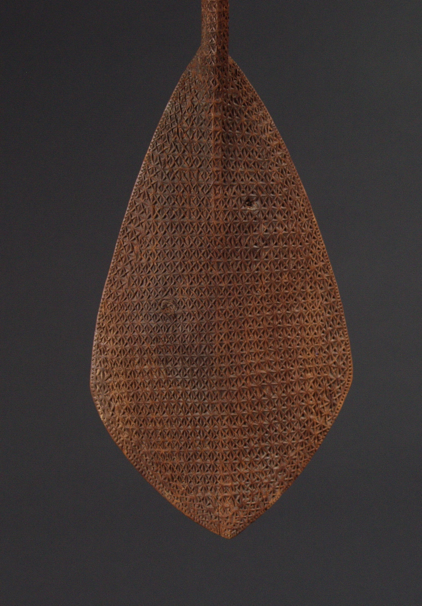#OC222: 19th century Austral Island ceremonial paddle with intricate  
designs