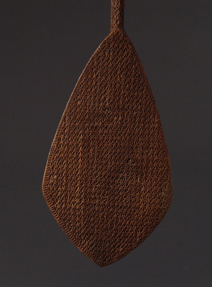 #OC222: 19th century Austral Island ceremonial paddle with intricate  
designs