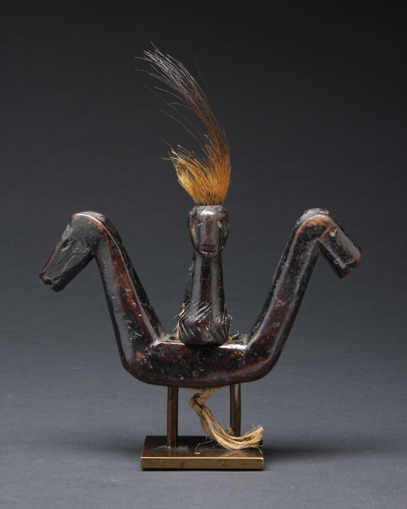 #PH210: Northern Philippine gong handle in the form of a double-sided figure and two horse heads