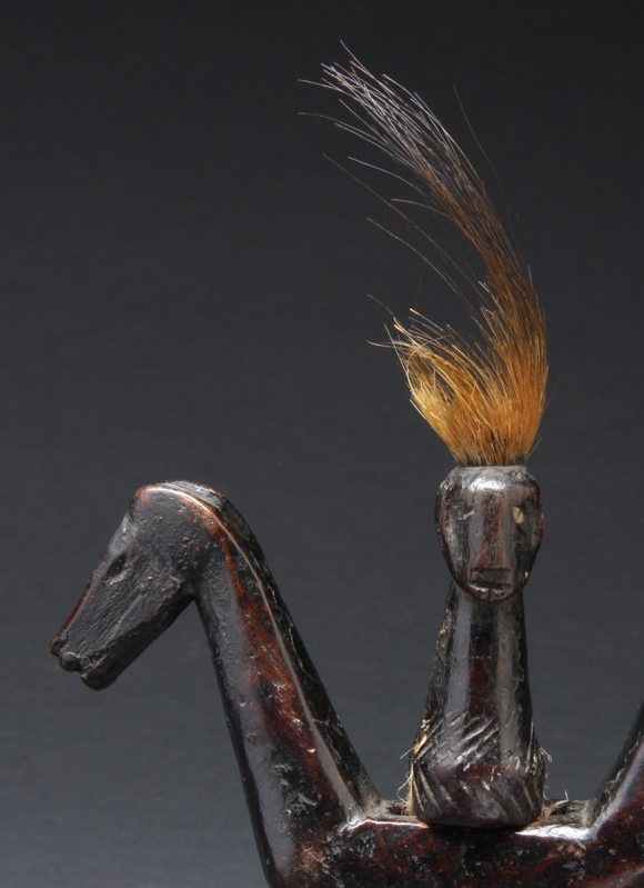 #PH210: Northern Philippine gong handle in the form of a double-sided figure and two horse heads
